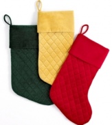 A luxurious touch. Christmas stockings combining a classic quilted pattern and rolled cuff in sumptuous velvet offer festive elegance season after season.