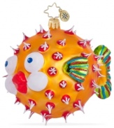 Bursting with holiday joy, the Puff a Kiss ornament from Christopher Radko is dotted with red and white and puckering up under the mistletoe in handcrafted glass.