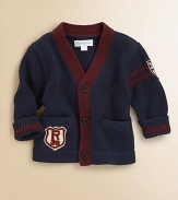 An essential V-neck cardigan in soft flat-knit cotton is accented with stripes and varsity-inspired details for a collegiate look.V-neckLong sleevesButton-frontHand welt pocketsRibbed cuffs and hemCottonMachine washImported Please note: Number of buttons may vary depending on size ordered. 