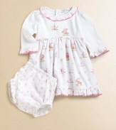 Your little princess will look the part in this charming pima cotton print right out of a fairy tale.Round neckline with embroidered ruffle Solid bodice with embroidery Empire waist with soft gathering Long sleeves with embroidered ruffles Contrast scalloped edging Back snaps Ruffled hem Bloomer in complementary print with elastic waist and leg openings Cotton Machine washImported Please note: Number of snaps may vary depending on size ordered.