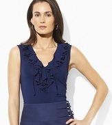 A cascade of ruffles exudes feminine style in our Stu sleeveless top, fashioned from sleek jersey.