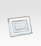Inspired by the natural lines of a broken shell, this design is both organic and modern.Cast aluminumPearlized enamel centerAccommodates 4 X 6 photoImported