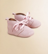 Adorable baby booties crafted in ultra-plush suede in a lace-up silhouette.Ribbon tieSuede upperLeather liningLeather solePadded insoleImported