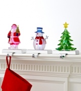 Merry and bright, these colorful figurines hold and light Christmas stockings with irresistible cheer. Featuring Santa, a snowman and tree perched on silvertone metal hooks.