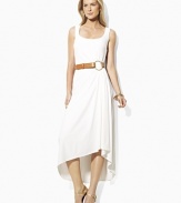 Infused with romantic movement, a sleek tank dress is crafted with subtle pleating at the waist that creates a fluid draped hemline.