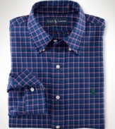 Tailored from lustrous, mercerized cotton twill in a colorful plaid print, the handsome trim-fitting sport shirt exudes timeless preppy style.