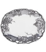 The Grape Weave oval tray will add a touch of whimsy to your tabletop or mantle. A raised and intricate pattern of grape clusters on high-polished aluminum conveys unparalleled elegance.