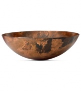 Finished by fire, each Burnished Copper bowl is an individual. Rich earth tones and a unique mottled design distinguish the sculptural vessel for modern settings. By Donna Karan Lenox.