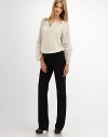 Ankle zippers add edge to this slim and luxe organic cotton pair.Side zipper Ankle zippers Waist darts Back welt pockets Inseam, about 26¾ 95% organic cotton/5% spandex Machine wash Imported Additional Information Women's Premier Designer & Contemporary Size Guide 