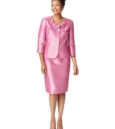 Shimmering shantung makes this skirt suit by Kasper look luxe, while seamed details add a tailored look. A band of fabric flowers at the neck is a pretty finishing touch.