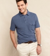 Simple casual style is this preppy polo from Tommy Hilfiger with a pocket accent.