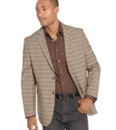 Go bold and pair your patterns. This Sean John plaid blazer makes a statement all its own.