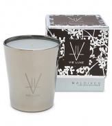 Created to inspire and soothe the soul, blending the sensual scents of exotic Ceylon tea, delicate heliotrophe and lush green palm leaves. Presented in nickel-finished glass, it is derived from all-natural beeswax, skillfully blended with unique botanical waxes and the rarest and most seductive fine fragrance oils from around the world. 60-hr. burn time. 8 oz. 