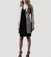 Modern colorblocking meets trench-inspired details, in this all-weather, on-trend design.Shoulder epaulettesFold-over collarDouble breasted button frontSelf beltLong sleeves with belted cuffsSide slash pocketsButton-down rainflapAbout 34 from shoulder to hemCottonDry cleanImportedOUR FIT MODEL RECOMMENDS ordering true size. 
