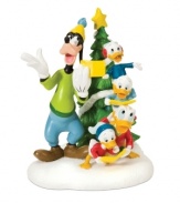 Goofy and Daffy lead three young ducks in cherished Christmas carols. Posing in front of a star-topped tree, these favorite characters add a silly, joyful note to Mickey's Village. From Department 56.