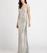 Glittering, textural allover sequins decorate this stunning floor-length silhouette.ScoopneckCap sleevesFront gathersCutout backFully linedAbout 48 from natural waistNylonDry cleanMade in USA of imported fabric