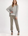 A feminine, ankle-skimming take on a classic functional design.Button closureZip flyBelt loopsSelf-tieFront and back pocketsZipper detail on cuffsInseam, about 27Rise, about 1675% lyocell/25% linenDry cleanImported Model shown is 5'10 (177cm) wearing US size Small. 