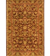 Energetic reds highlight the lush floral motif of this visually impressive area rug from Safavieh. Tufted in India from pure wool, this rug emerges from the annals of antiquity to bring spectacular style and time-honored quality to your home. (Clearance)