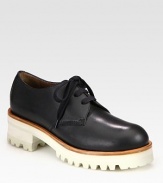 An elevated two-tone platform adds modern appeal to this menswear-inspired design of rich Italian leather. Rubber and foam heel, 1¾ (45mm)Rubber platform, 1 (25mm)Compares to a ¾ heel (20mm)Leather upperLeather liningRubber trek solePadded insoleMade in ItalyOUR FIT MODEL RECOMMENDS ordering one half size up as this style runs small. 