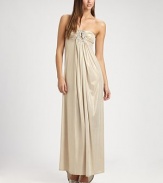 This dazzling, flowy design features an alluringly low-draped back and a jeweled cutout detail at the bust.Strapless necklineJeweled cutout detailRuched bustGathered frontLow draped back with gathered back panel strapAbout 44 from natural waist91% polyester/9% spandexHand washMade in USA of imported fabric