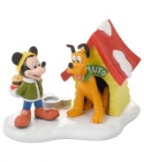 No bones about it, Pluto is filled with excitement over the special holiday treat Mickey delivers to his dog house. A joyous moment in Mickey's Christmas Village, from Department 56.