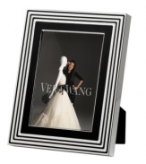 Add new elegance to beautiful memories with Vera Wang's With Love Noir picture frame. Geometric detail lends metallic shimmer to chic black enamel in a home accent that invokes modern and deco design.