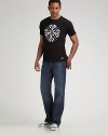 Classic blues in crosshatched denim with a relaxedfit and a worn-in appearance. Five-pocket style Arch stitching on back pocket Zip fly Inseam, 33/34 Cotton; machine wash Imported
