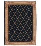 Every work of art deserves a frame. The Ashton House rug collection sets new standards of richness with their opulent colors, European-inspired decorative motifs, and luxuriously textured wool pile. An elaborately detailed frame displays a classic design of diamond shapes with center studs, in brown over a striking black background. The result is as ornate and rich as it is simple.