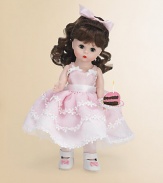 This pretty brunette miss brings birthday wishes to a lucky young lady on her special day.8 cloth dollDressed in a pink, full-skirted frock with floral embroidery and white Mary Jane slippersShe offers a luscious-looking slice of birthday cakeRecommended for ages 3 and upImported