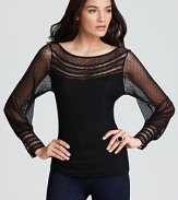 Exquisite, feminine details enrich this sassy sheer top by GUESS.