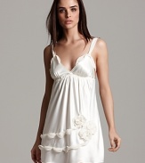 Feel ultra-feminine in this chiffon chemise featuring a chain and rosette detail on the hem.