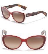 Chic cat eye sunglasses with contrast winged temples and logo embellished arms.