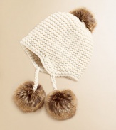 Crafted in a solid classic knit, our vintage-inspired earflap hat is adorned with stylish faux fur trim for a timeless look.Knit crownEarflaps with pom-pom tassels tie beneath the chinWool/CashmereDry cleanImported