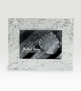 Delicately veined impressions of fallen leaves add a sylvan glow to favorite photos. Fits a 5 X 7 photoSilverplated and tarnish resistantHandmade in India