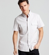 Loosely inspired by a military design, this short-sleeve button-down shirt complements casual jeans and refined pants alike.
