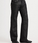 A relaxed fit with modern sensibilities, rendered with stitched flap pockets and occasional wrinkles in washed black denim. Five-pocket styleStitched flap back pocketsInseam, about 34CottonMachine washMade in USA 