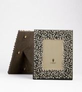 A charming platinum floral motif is laid over a suede background, creating an eye-catching, completely handmade frame fit for any treasured photograph. From the Lorel Collection Accommodates a 4 X 6 photograph Overall, 7¼ X 9 Imported 