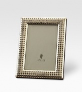 Memories are cherished like jewels, so it's only fitting that a photograph sit within a frame inspired by fine jewelry with hand-applied Swarovski crystals and fresh-water pearls. From the Perlée Collection Accommodates a 4 X 6 photograph Brass with Swarovski crystals & fresh-water pearlsBeveled glass, satin liner, leather backImported