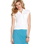 A back cutout adds an element of surprise to Jessica Simpson's fun update of the classic polo shirt!