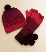 Soft and warm, with a cheery Nordic pattern and two bobbly pompoms. Thumb warmerPretty color paletteDry cleanImported