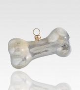 Celebrate everyone's best friend with this shimmering bone-shaped ornament, delicately crafted of mouth-blown, hand-painted glass, in honor of precious pooches everywhere.Glass3.5L X 1.5H X 1.5DImported