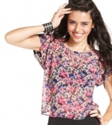 With its skin-baring cutout and contrast-color design at the back, this top from Material Girl fuses delicate style with dark edge.