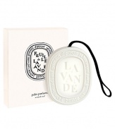 An innovative new way to scent your surroundings, specifically designed for small spaces; wardrobe, drawers. The porcelain pendent contains a highly scented hard wax palette that will gradually releases its scent for 2-3 months or longer. The pendent is fitted with a ribbon for hanging purposes. Feuille de lavande (lavender leaf) the scent calls to mind the lavender fields in the south of France; the sweet flowers and refreshing green leaves. 