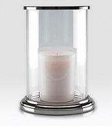 Gleaming glass and polished nickel is crafted to house a single pillar candle for a beautiful, ethereal effect.5¾ L x 8 HGlass and nickelImported