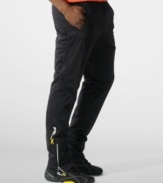 Designed for high-level comfort and superior performance, an athletic track pant is crafted in sleek stretch microfiber with hydro-mesh panels and reflective graphics.