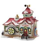 The North Pole Bike Shop will have cyclists wheeling, with a tire banister, padlock vault and horn-shaped wind vane. A soft glow from inside makes it an inviting place for a winter tune-up or warm-up, from Department 56.