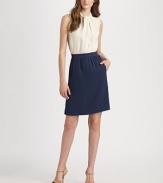 Feminine in every way, a fitted bodice meets a flared skirt with a timeless twist front and convenient slash pockets. Twist-front, ruched neckSleevelessFlattering gathered waist detailsConcealed back zipperBack seamFully linedAbout 37 from shoulder to hem70% viscose/15% silk/14% acrylic/1% elastaneDry cleanImported Model shown is 5'10 (177cm) wearing US size 4. 