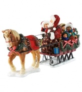 All aboard! Santa takes a few friends along for a sleigh ride. A festive dressed horse leads the way for the magical journey through town.