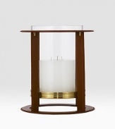 Crafted from gleaming glass, and encased in a supple saddle leather frame to evoke a heritage panache.12 L x 14¼ H6 X 6 candle recommendedLeather, glass and brassImported