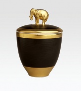 A candle with the intoxicating scent of pink champagne, encased in handcrafted, fine Limoges porcelain with 14k goldplated accents. Includes a fitted lid with a clasp sculpted in the shape of an elephant on an island of 14k gold. Handcrafted porcelain 5½H X 5 diam. Imported 